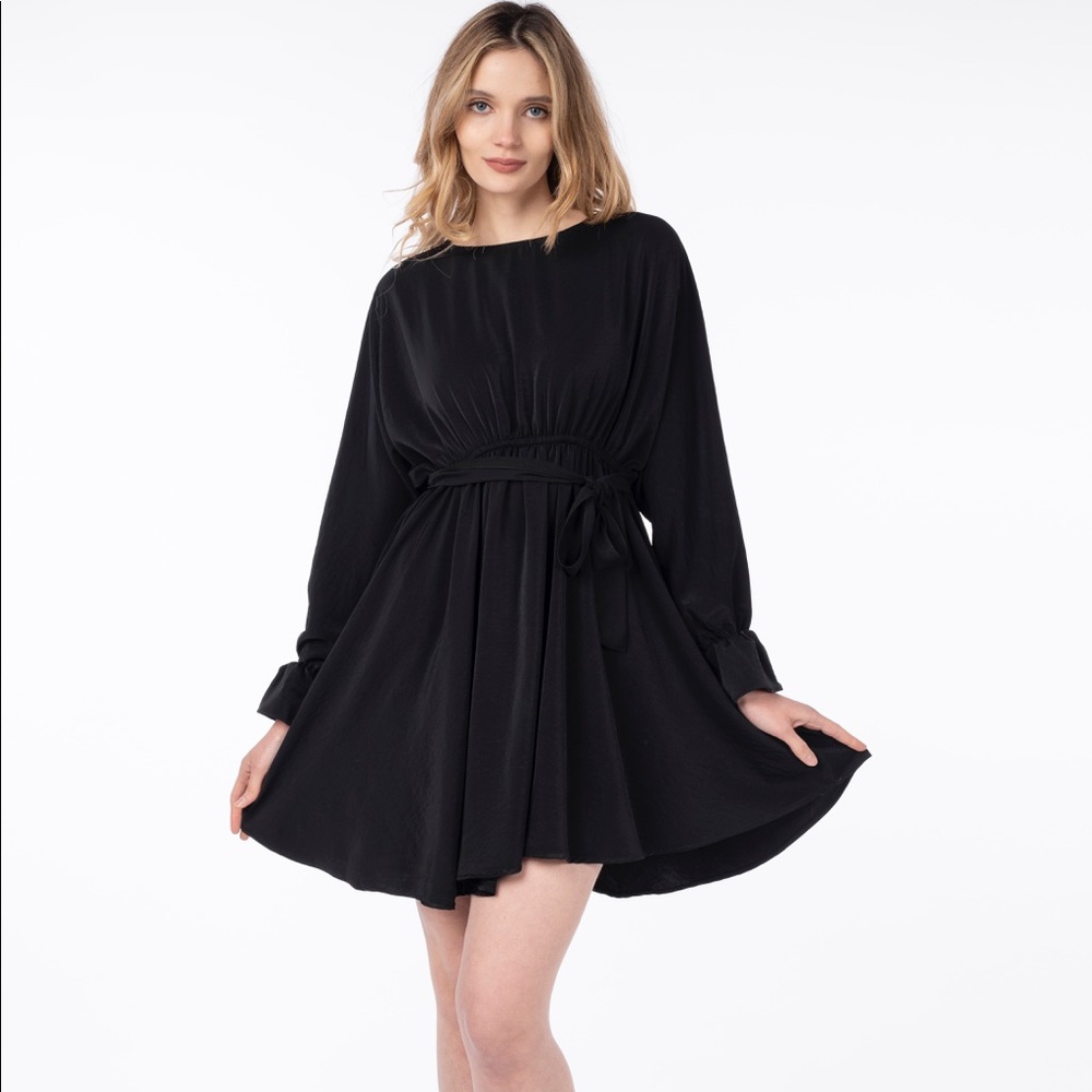 Black Long sleeve mini dress. Polyester material comes in S, M, and L
